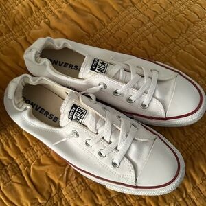 Converse Low Top Sneakers in White with Red Trim